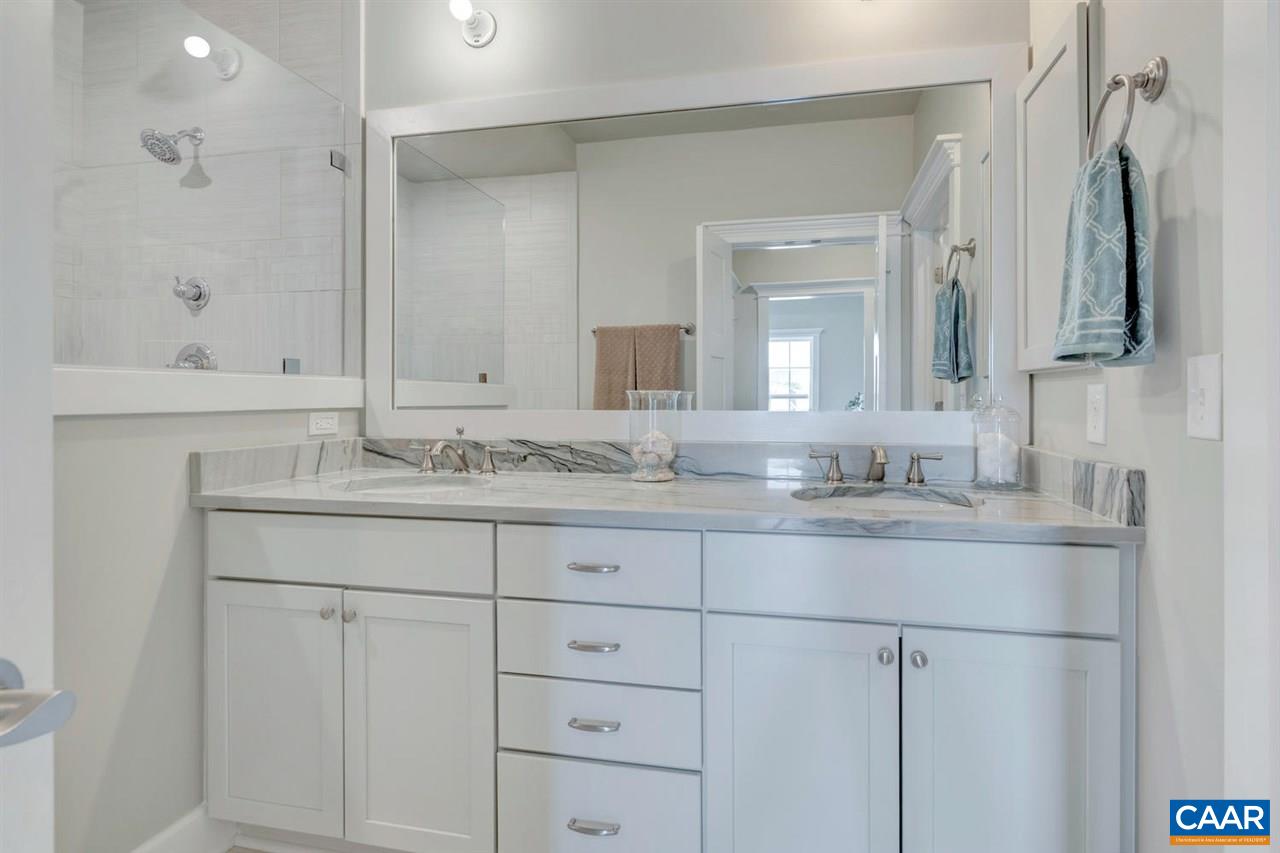 30 Portelet Road Crozet, VA 22932 - Photo 8 of 25 a bathroom with double sink and a mirror