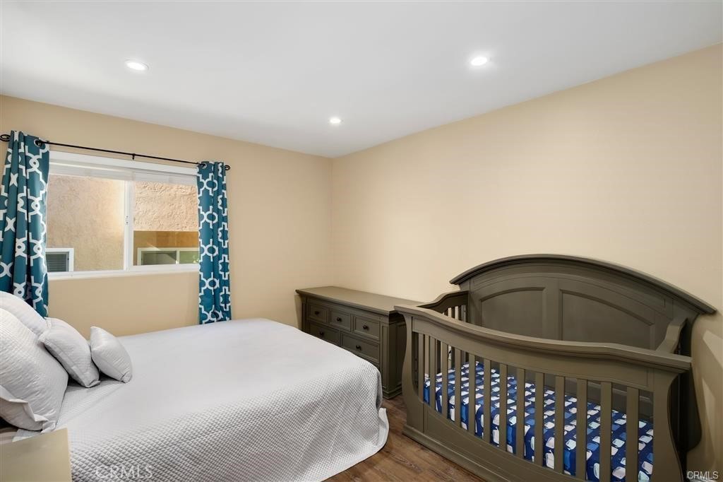 31909 Del Cielo, Unit 11 Bonsall, CA 92003 - Photo 13 of 16 a bedroom with a bed and dresser