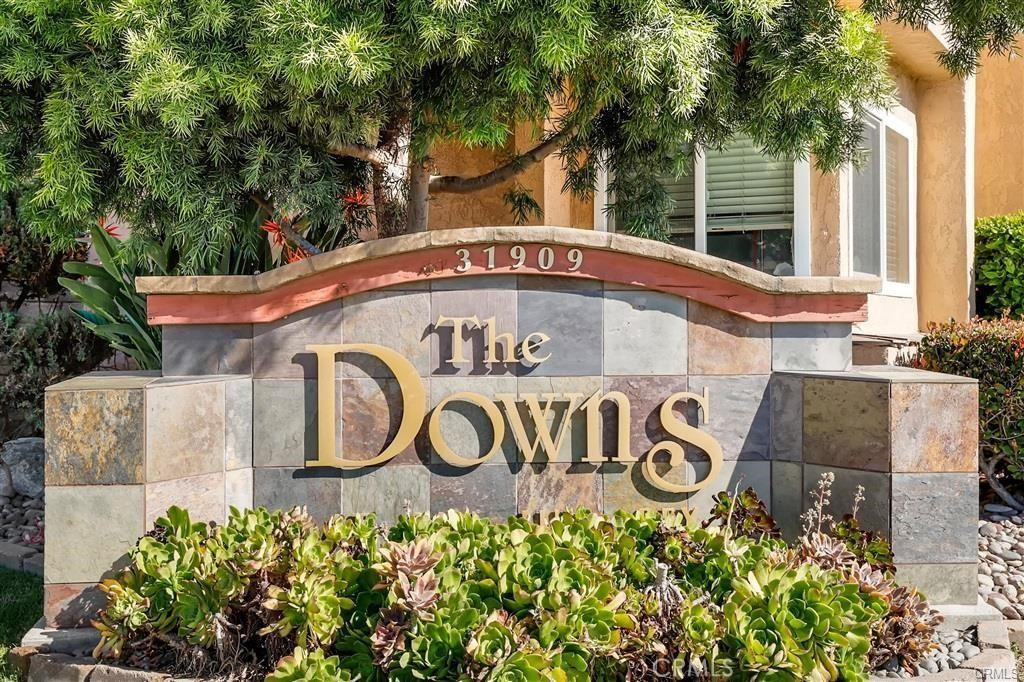 31909 Del Cielo, Unit 11 Bonsall, CA 92003 - Photo 2 of 16 a sign that is on a pole
