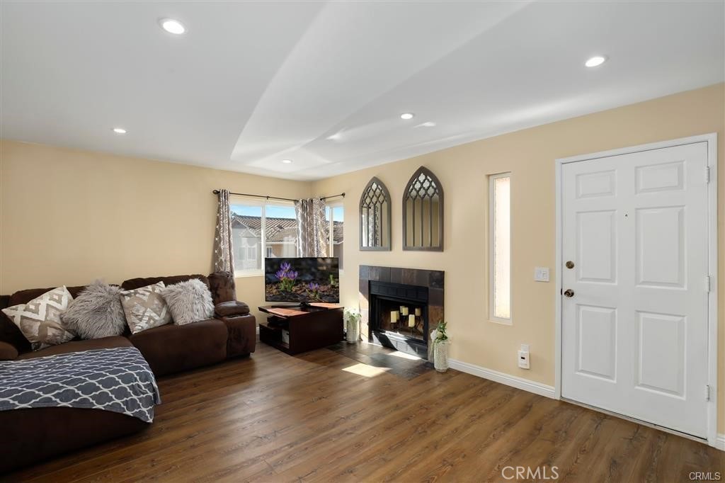 31909 Del Cielo, Unit 11 Bonsall, CA 92003 - Photo 3 of 16 a living room with furniture and a fireplace