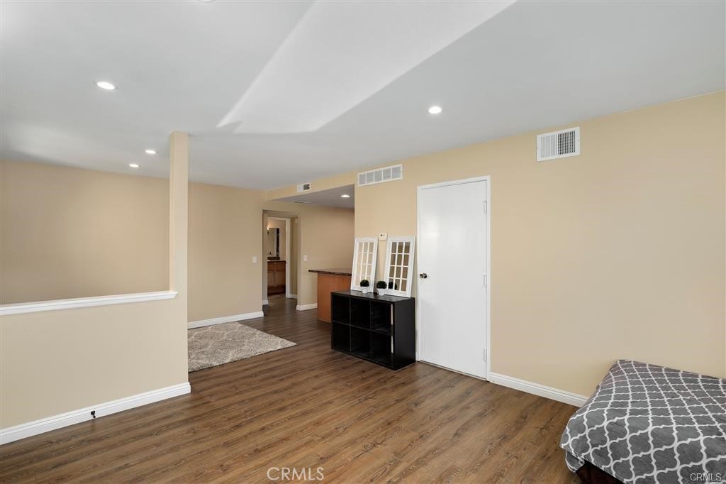 31909 Del Cielo, Unit 11 Bonsall, CA 92003 - Photo 10 of 16 a view of empty room with wooden floor