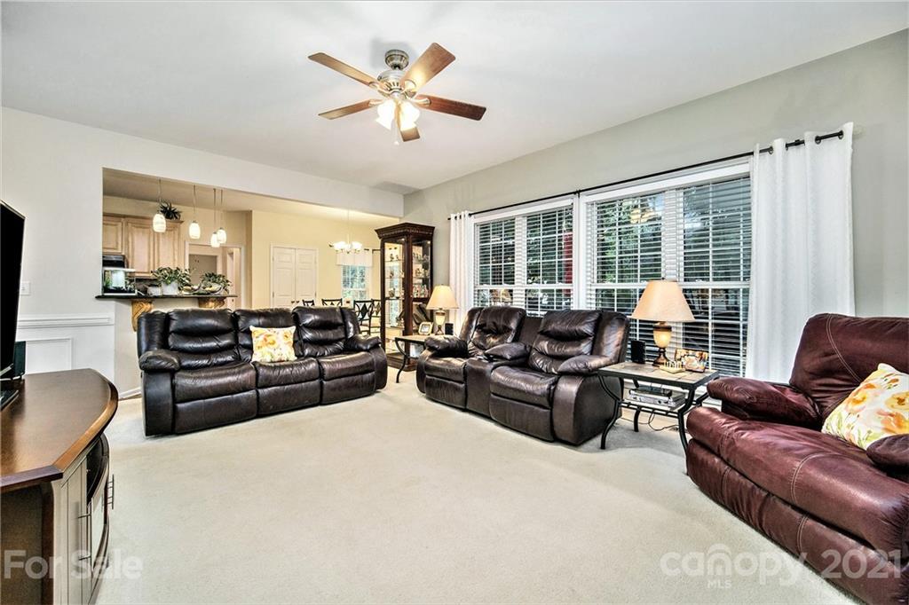 17005 Hampton Trace Road Huntersville, NC 28078 - Photo 15 of 40 a living room with furniture wooden floor and a large window