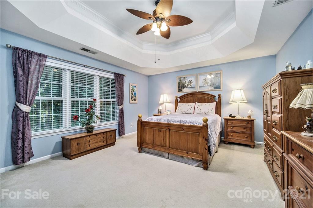17005 Hampton Trace Road Huntersville, NC 28078 - Photo 17 of 40 a spacious bedroom with a bed and a large window