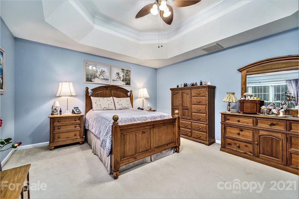 17005 Hampton Trace Road Huntersville, NC 28078 - Photo 18 of 40 a bedroom with a bed and dresser