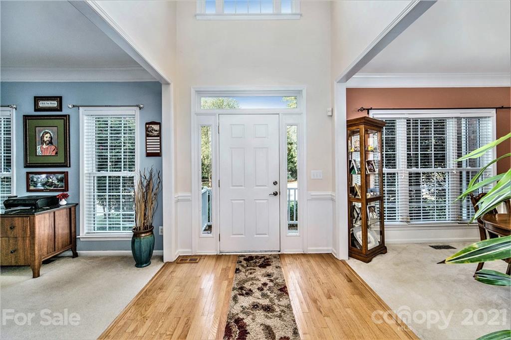17005 Hampton Trace Road Huntersville, NC 28078 - Photo 3 of 40 a view of a livingroom with wooden floor and windows