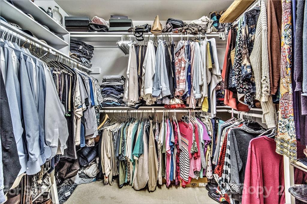 17005 Hampton Trace Road Huntersville, NC 28078 - Photo 22 of 40 a view of walk in closet with clothes