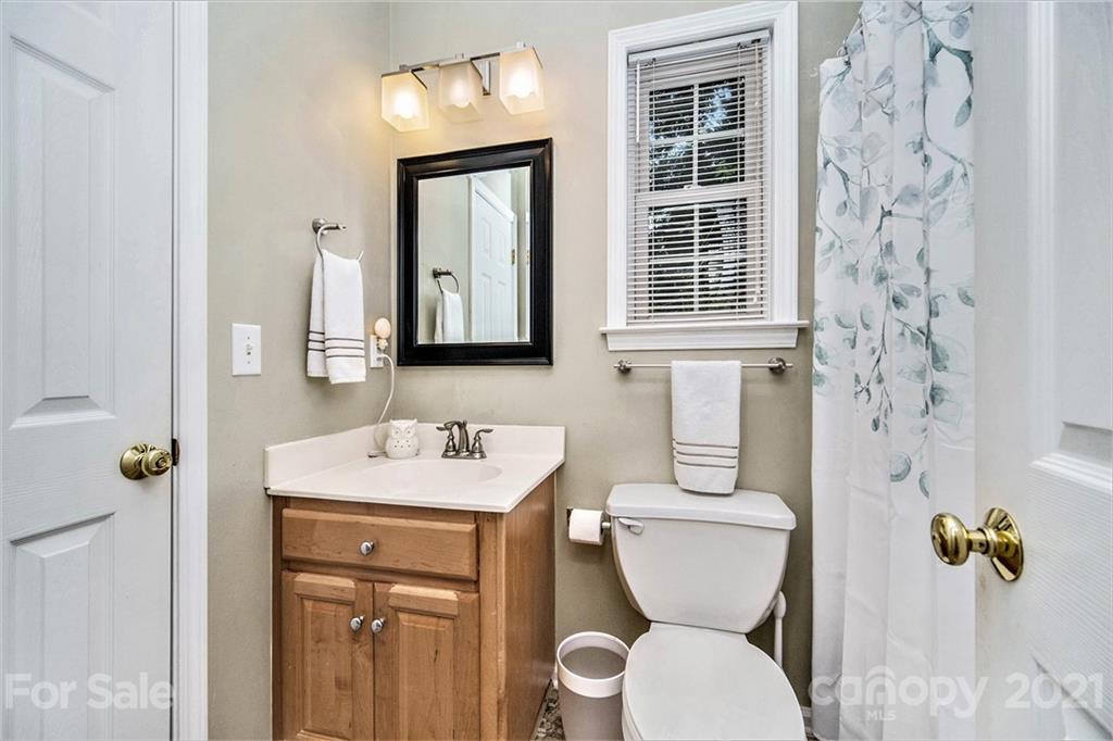 17005 Hampton Trace Road Huntersville, NC 28078 - Photo 24 of 40 a bathroom with a toilet sink and mirror