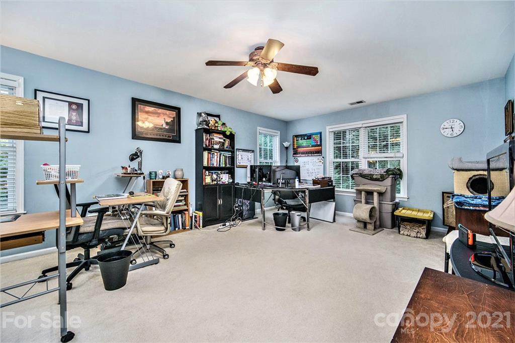 17005 Hampton Trace Road Huntersville, NC 28078 - Photo 28 of 40 a view of a livingroom with workspace and a window