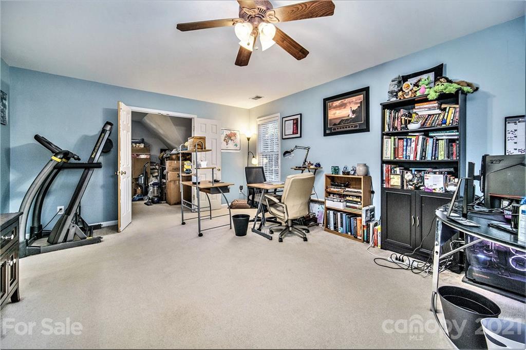17005 Hampton Trace Road Huntersville, NC 28078 - Photo 29 of 40 a view of a livingroom with workspace and a ceiling fan