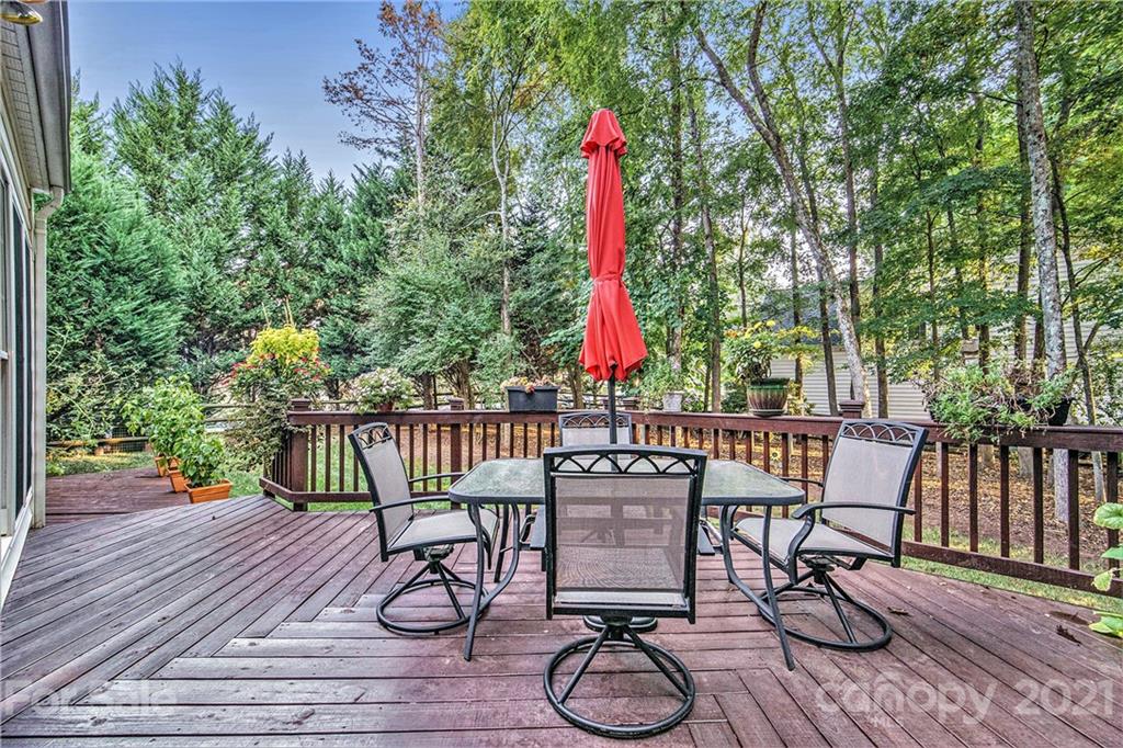 17005 Hampton Trace Road Huntersville, NC 28078 - Photo 33 of 40 a view of a chairs and table in patio with wooden fence