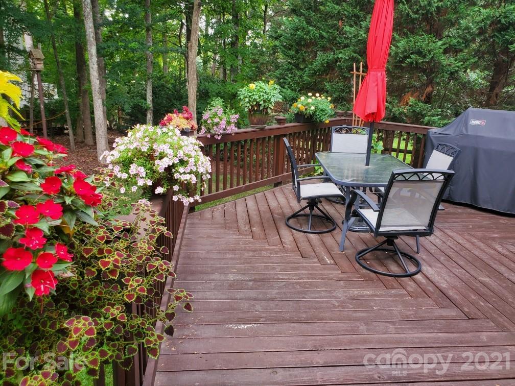 17005 Hampton Trace Road Huntersville, NC 28078 - Photo 34 of 40 a view of a chairs and table on the wooden floor