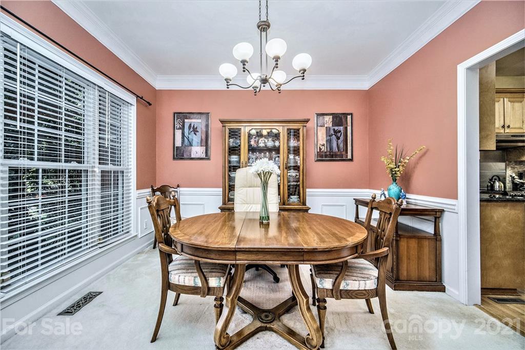 17005 Hampton Trace Road Huntersville, NC 28078 - Photo 5 of 40 a view of a dining room with furniture and chandelier