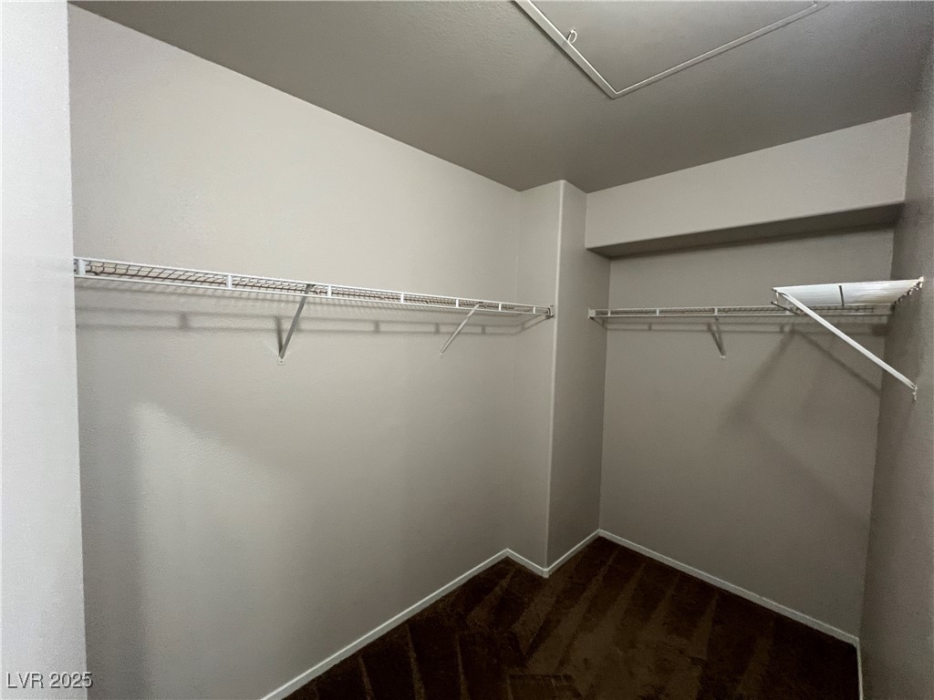 7255 West Sunset Road, Unit 2072 Las Vegas, NV 89113 - Photo 9 of 19 Walk in closet featuring dark carpet
