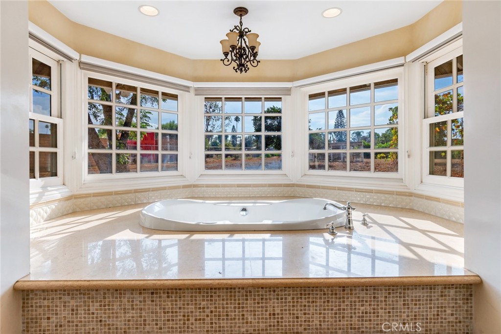 7770 Broadacre Place Riverside, CA 92504 - Photo 17 of 42 a view of a balcony with a potted plant and a window