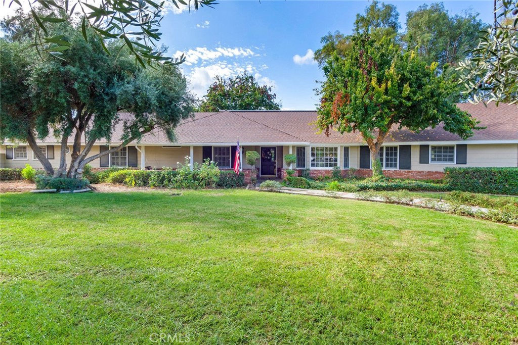 7770 Broadacre Place Riverside, CA 92504 - Photo 2 of 42 a front view of a house with garden
