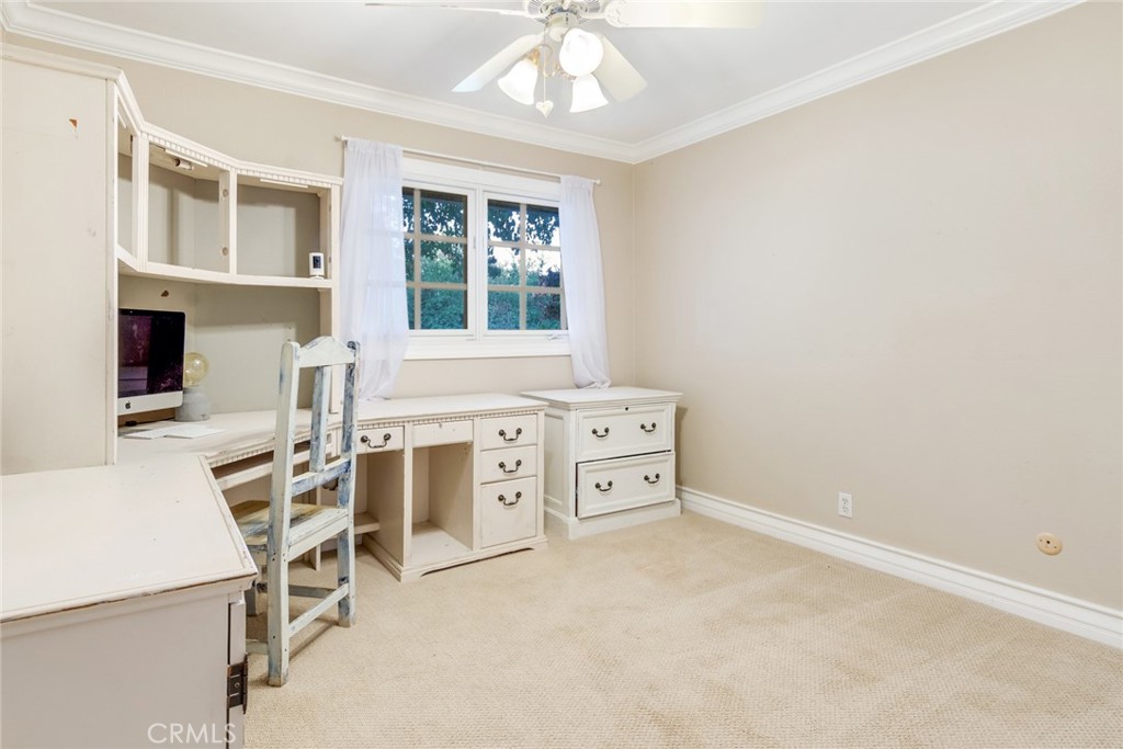 7770 Broadacre Place Riverside, CA 92504 - Photo 22 of 42 a room with furniture a chandelier and a window