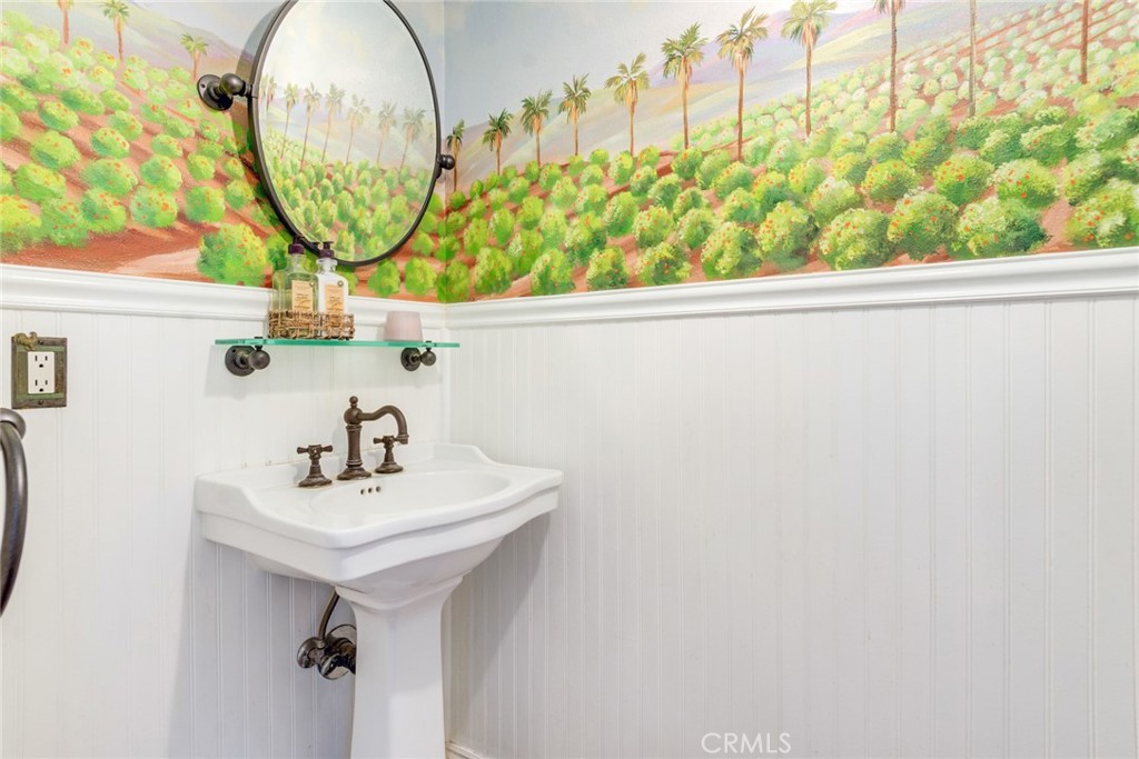 7770 Broadacre Place Riverside, CA 92504 - Photo 27 of 42 a bathroom with a sink and a mirror