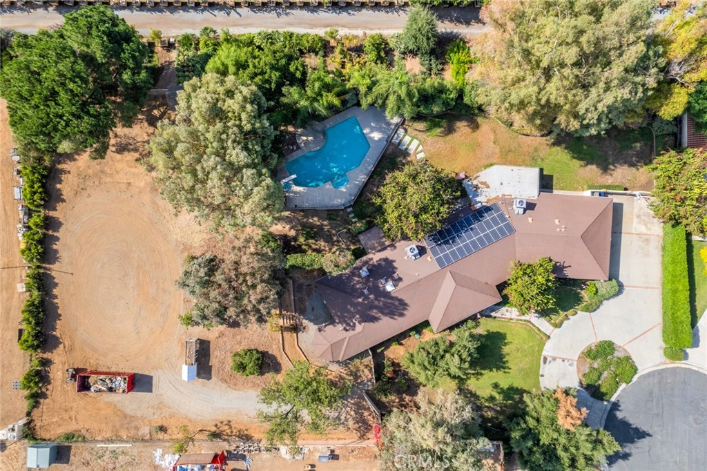 7770 Broadacre Place Riverside, CA 92504 - Photo 37 of 42 an aerial view of a house with a yard and lake view