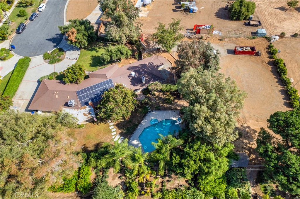 7770 Broadacre Place Riverside, CA 92504 - Photo 42 of 42 an aerial view of residential house with yard and swimming pool