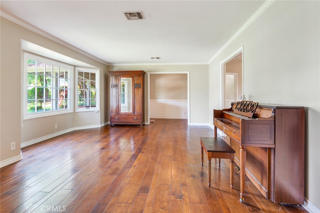 7770 Broadacre Place Riverside, CA 92504 - Photo 5 of 42 a furnished livingroom with windows and wooden floor