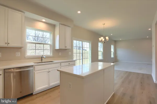 a kitchen with a sink and a large window