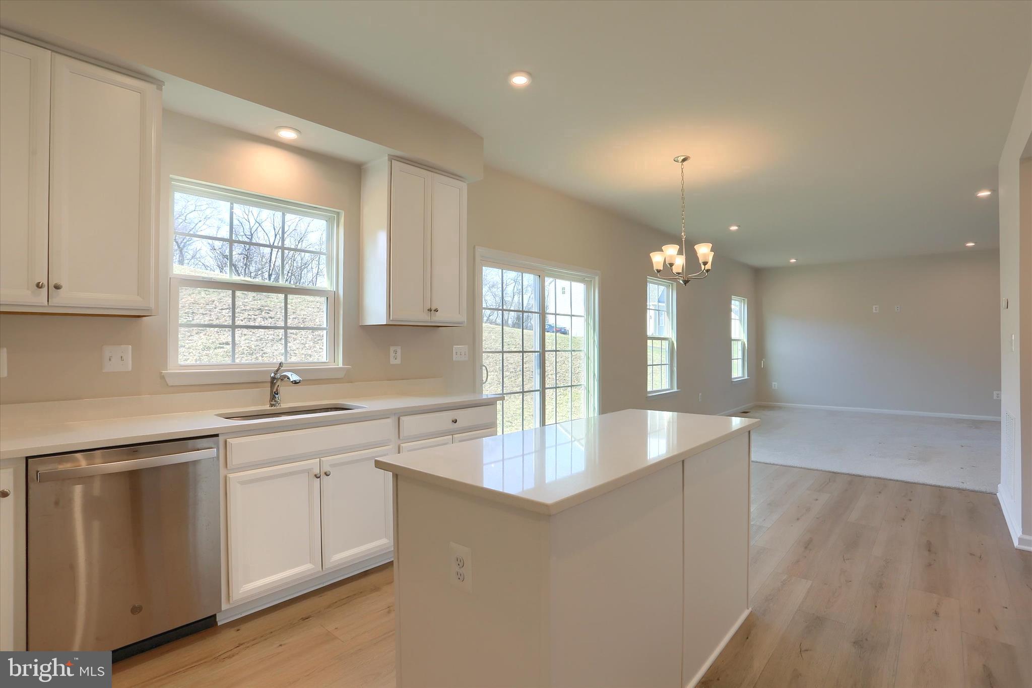 562 Monocacy Trail Spring Grove, PA 17362 - Photo 13 of 67 a large kitchen with kitchen island a sink stainless steel appliances and cabinets