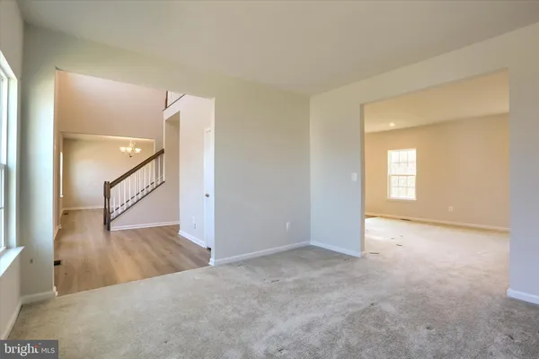 an entryway with wooden floor