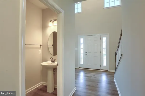 a bathroom with a sink and mirror