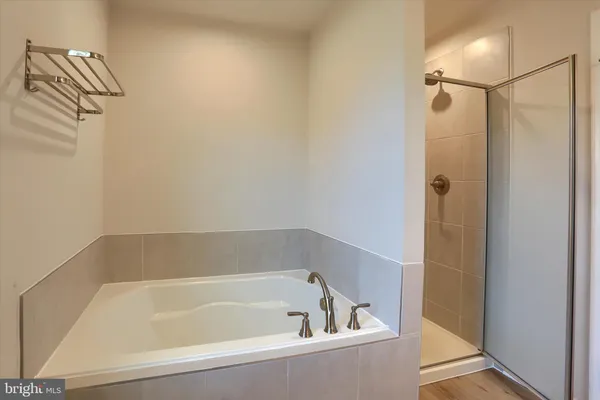 a bathroom with a glass shower door