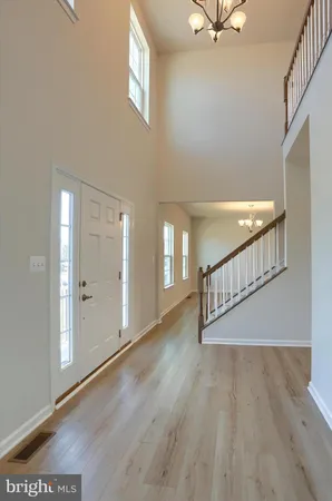 a view of an entryway with wooden floor