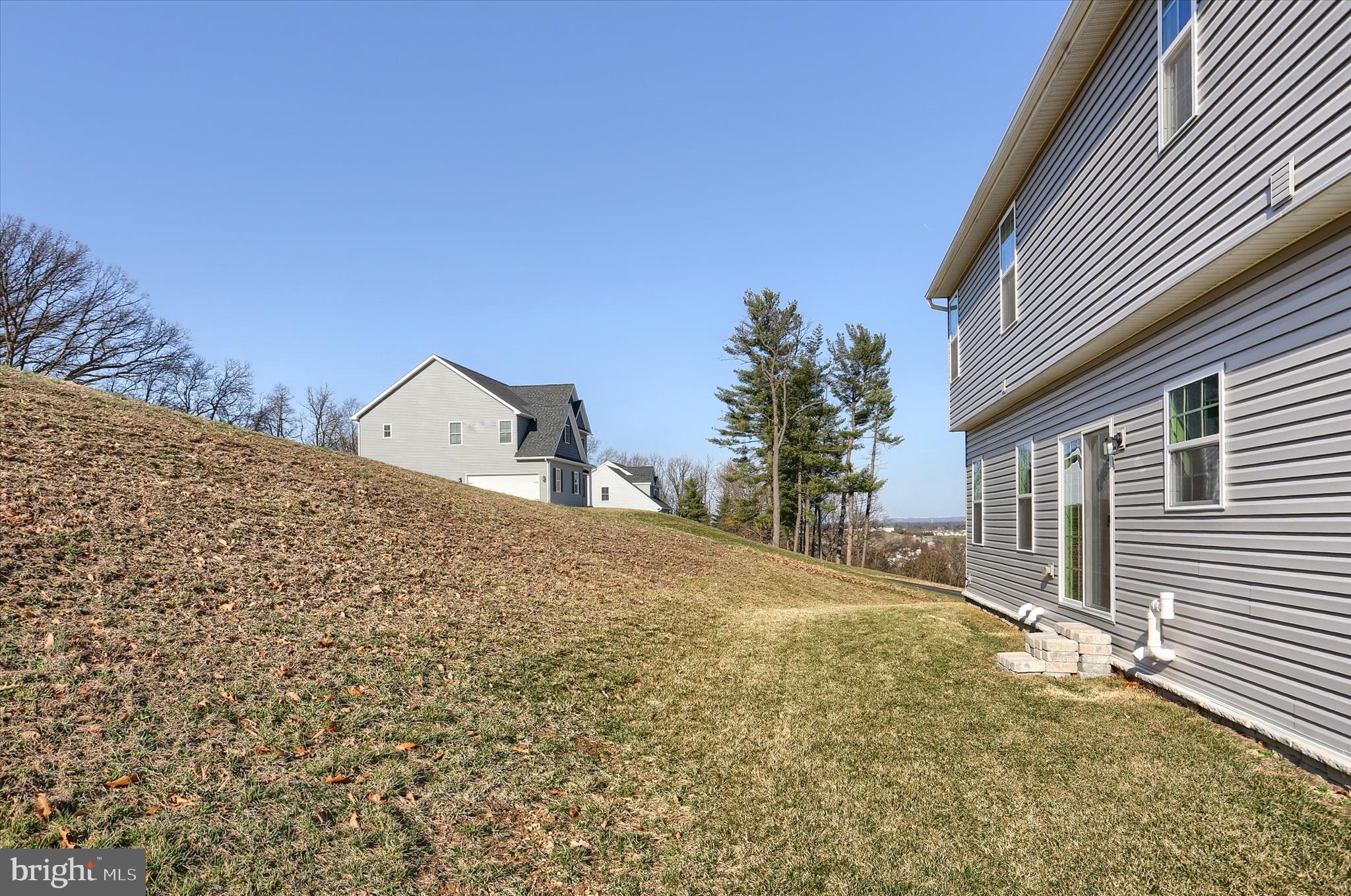 562 Monocacy Trail Spring Grove, PA 17362 - Photo 62 of 67 a front view of a house with a yard and garage