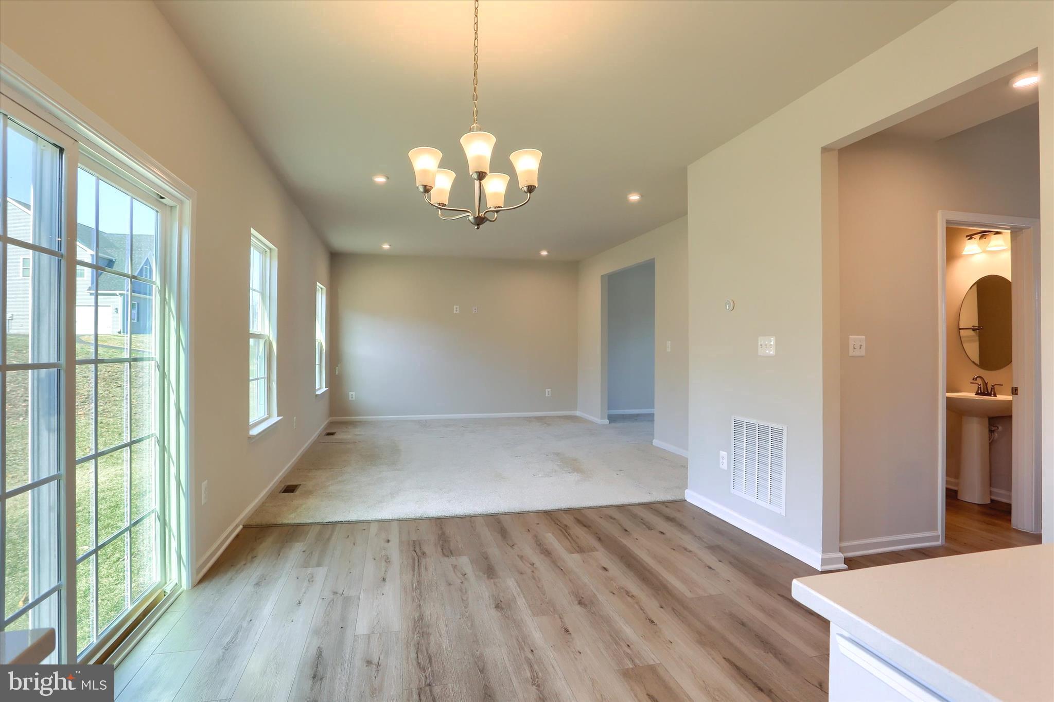562 Monocacy Trail Spring Grove, PA 17362 - Photo 10 of 67 wooden floor in an empty room with a window