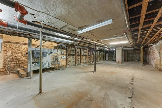 a view of an empty room with wooden walls