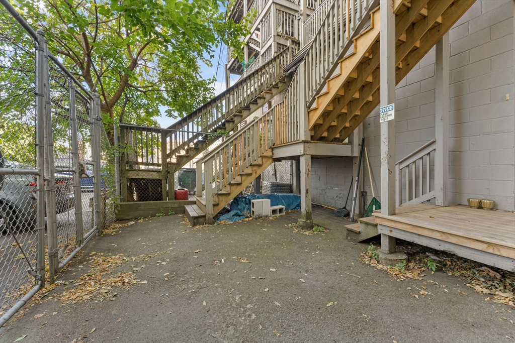 262-264 West Broadway Boston, MA 02127 - Photo 17 of 22 a view of a house with a yard and wooden fence
