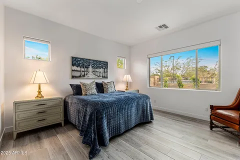 a living room with a bed furniture and a window