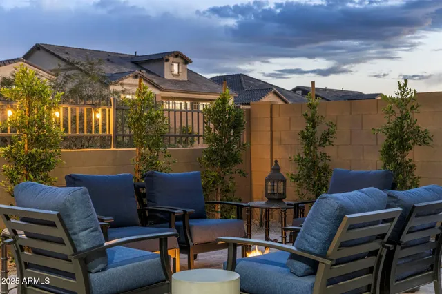 a outdoor living space with furniture and a fireplace