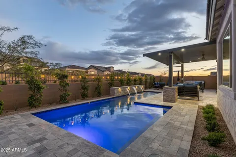 a view of a swimming pool with a patio