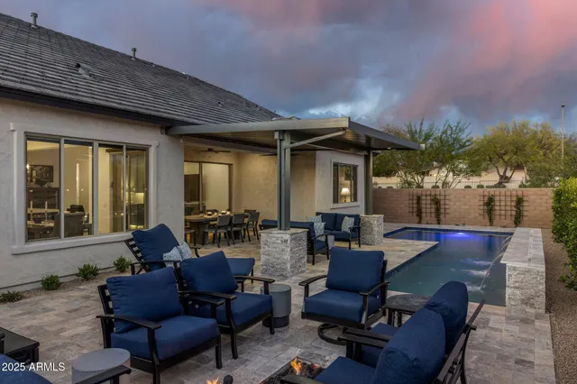 a outdoor living space with furniture and a fireplace