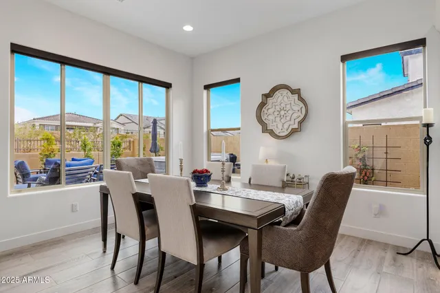a view of a dining room with furniture window and outside view