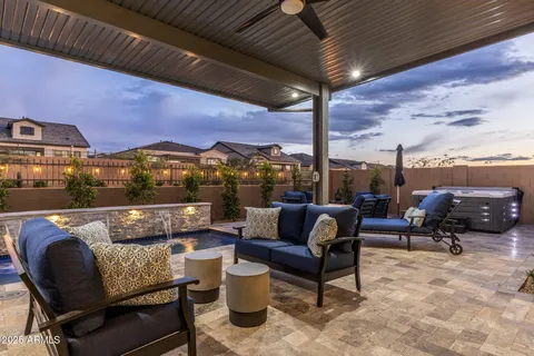 a roof deck with a table and chairs