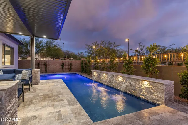 a view of swimming pool with outdoor seating