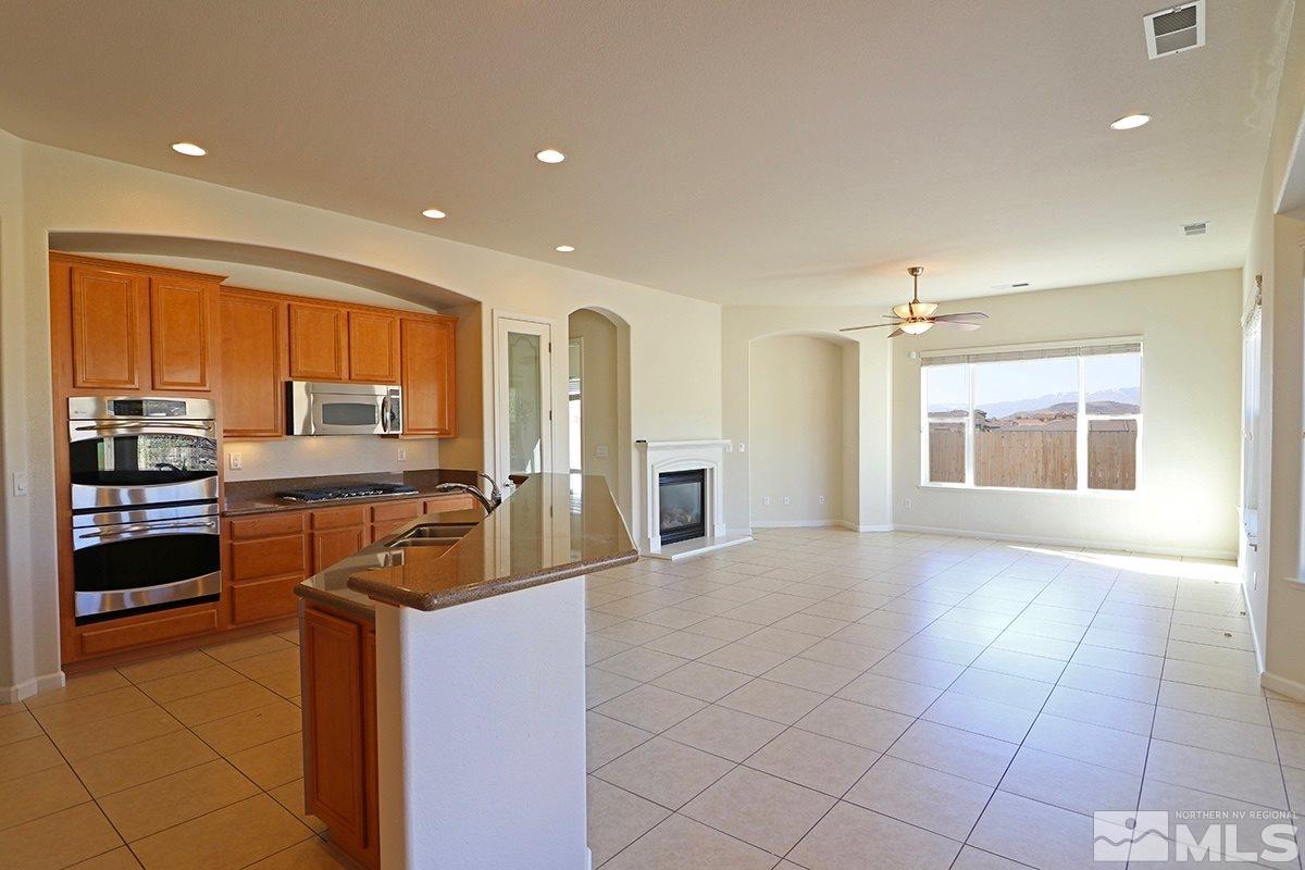 2835 Bull Rider Drive Reno, NV 89521 - Photo 3 of 25 a view of a kitchen with cabinets