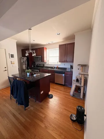 a kitchen with a sink appliances and cabinets