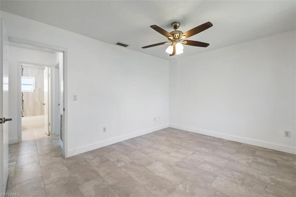 1948 46th Street Southwest Naples, FL 34116 - Photo 13 of 42 Spare room with baseboards and a ceiling fan