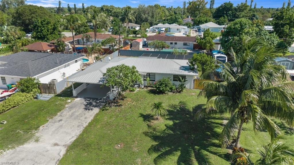 1948 46th Street Southwest Naples, FL 34116 - Photo 2 of 42 Aerial view of property and surrounding area with nearby suburban area