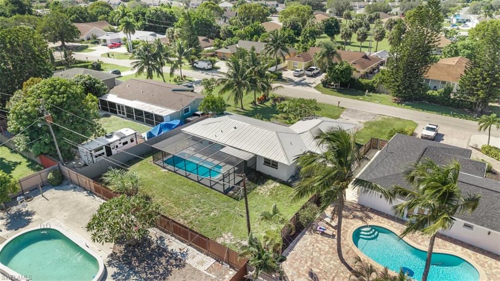 1948 46th Street Southwest Naples, FL 34116 - Photo 38 of 42 Aerial perspective of suburban area with a pool area