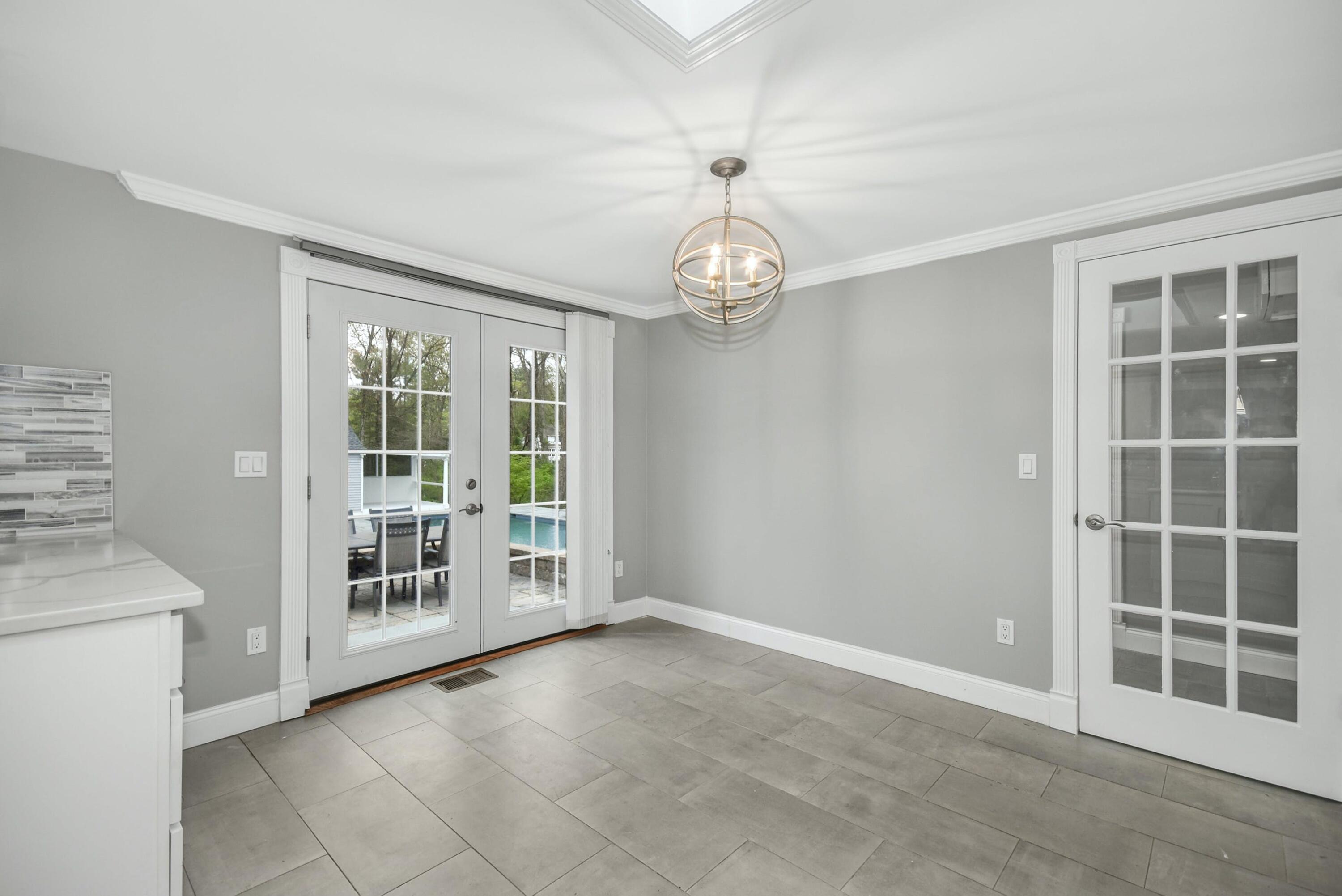 87 Juniper Road New Canaan, CT 06840 - Photo 12 of 28 a view of an empty room with a window
