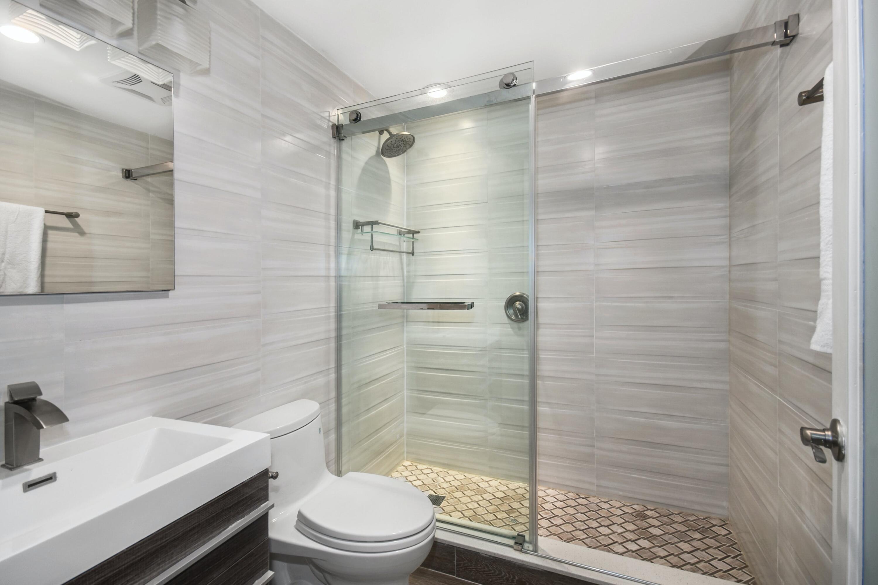 87 Juniper Road New Canaan, CT 06840 - Photo 23 of 28 a bathroom with a sink toilet and shower