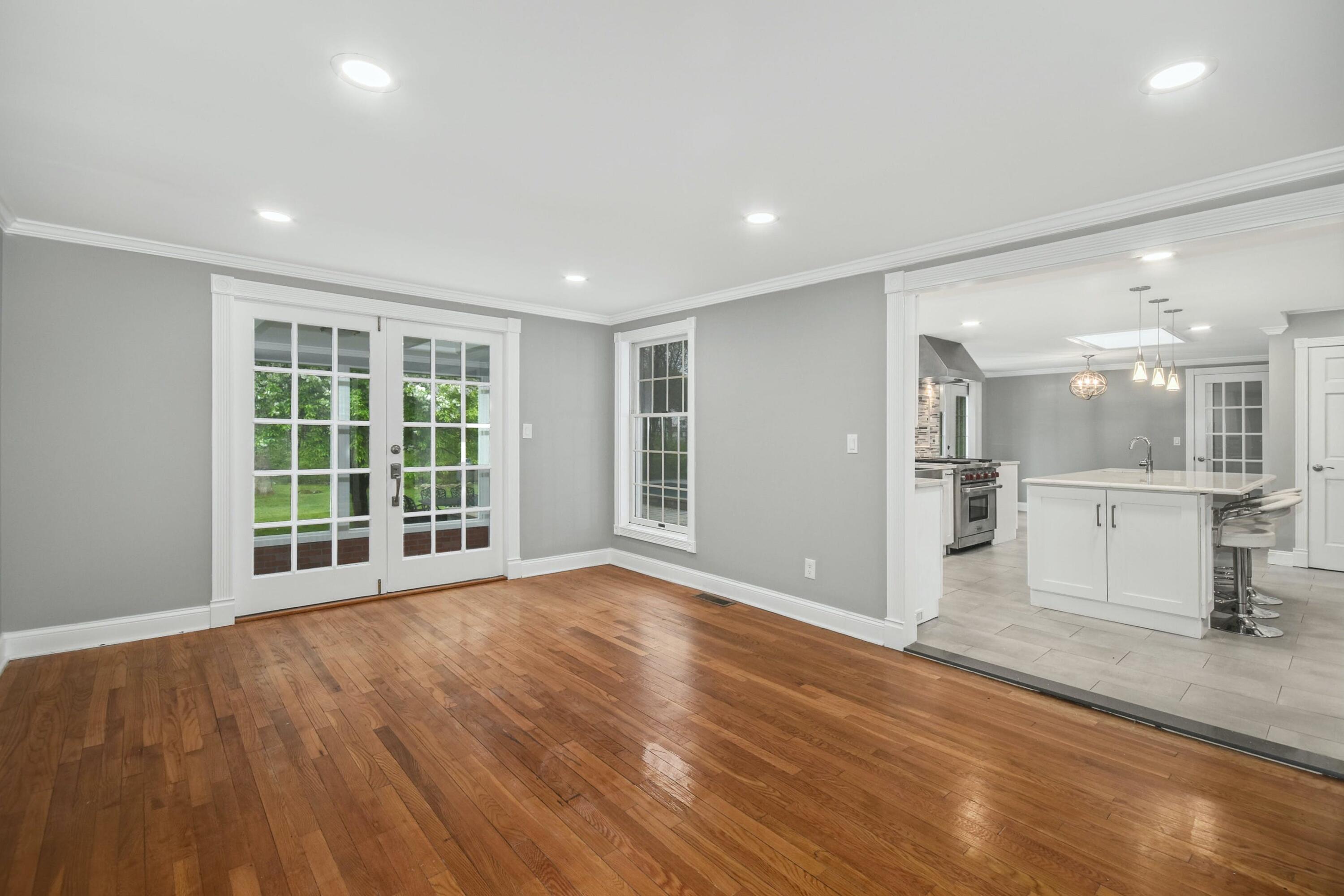 87 Juniper Road New Canaan, CT 06840 - Photo 8 of 28 a view of an empty room with wooden floor and a window