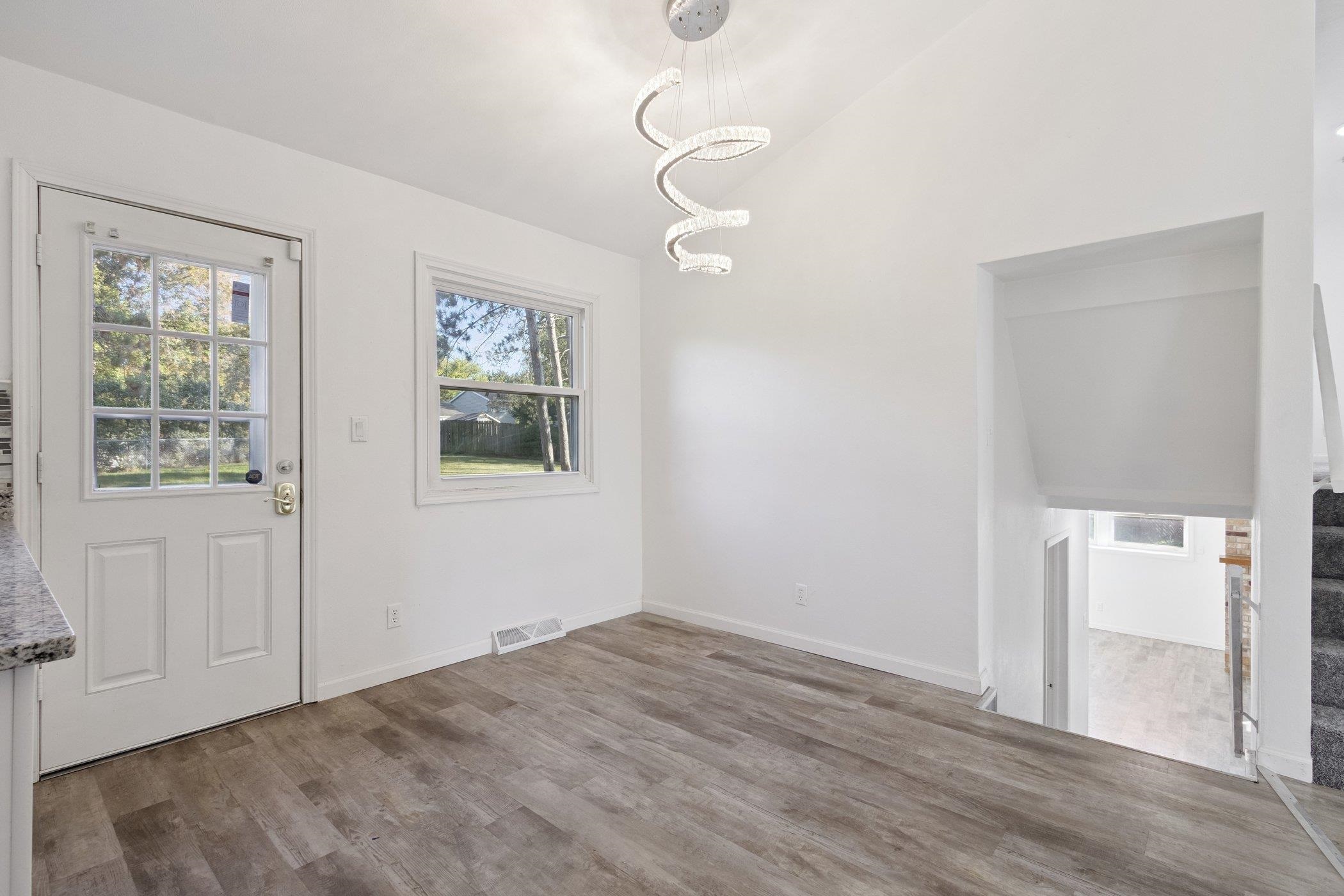 2724 Norway Pine Road Rockford, IL 61109 - Photo 15 of 49 a view of empty room with wooden floor and fan